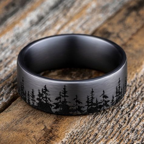 A striking forest-inspired motif rings the circumference of this handsome men's wedding band. Fashioned in tantalum, the inside of the ring is lined with smooth black tantalum to complete the look. The band features Comfort-Fit, which gives a narrower feel than it's actual width when worn. Comfort-Fit rings are designed to have a slightly rounded inside surface so less of the metal touches your finger, which enhances the feel of the ring while wearing and sliding it on and off your finger. Western Wedding Rings, Nature Wedding Ring, Antler Wedding Band, Mens Wedding Bands Black, Engagement Ring For Him, Stainless Steel Wedding Ring, Promise Rings For Guys, Mens Wedding Bands Tungsten, Black Wedding Band