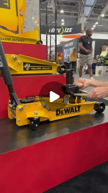 Travis Collins on Instagram: "Modular floor jack design. I like it a lot.  @dewalttough Floor Jacks coming  @nationalhardwareshow find  #mechanic #garageshop #workshop #jack #dewalttough #tools #newtools #floorjack #tbdshowcase #fixed" Floor Jack Storage, Floor Jacks, Mechanic Shop, Floor Jack, Mechanic Garage, Garage Shop, April 3, Cool Gadgets To Buy, Cool Gadgets