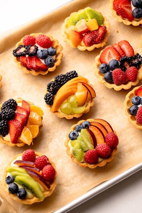 These Mini Fruit Tartlets are the perfect two-bite desserts, featuring mini tart crusts filled with a simple mascarpone cream, topped with fresh fruit, and finished with an optional but beautiful glaze. Mini Tart Pan Recipes, Kids Party Dessert Table, Fruit Tarts Recipe Dessert, Pretty Tarts, Fruit Tarts Mini, Fruit Tart Mini, Mini Fruit Tart, Easy Turkey Recipes Thanksgiving, Fruit Tart Filling