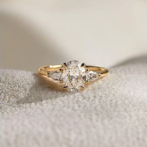 Oval-Cut Lab Diamond Engagement Ring, 14K Solid Gold Wedding Ring  By Rumasy Jewelry... ✨ 𝐃𝐢𝐚𝐦𝐨𝐧𝐝 𝐃𝐞𝐭𝐚𝐢𝐥𝐬 ✨ ↦ Center Diamond Shape : Oval ↦ Carat Weight: 2.32 Carat ↦ Side Diamond Shape : Pear Cut ↦ Side Diamond Weight: 0.95 Carat ↦ Color: H ↦ Clarity: VS1 ↦ Cut Grade: Excellent/Ideal ↦ Polish: Excellent ↦ Symmetry: Excellent ↦ Hardness: 10/10 ↦ Certification: IGI/GIA ↦ Ring Size: Size Selectable This lab-grown diamond was grown by the CVD /HTHP process. ✨ 𝐑𝐢𝐧𝐠 𝐃𝐞𝐭𝐚𝐢𝐥𝐬 ✨ Antique Gold Oval Engagement Ring, Gold Art Deco Engagement Ring Vintage, Smaller Wedding Rings, Bridal Rings Gold, Non Traditional Unique Engagement Rings Vintage Rose Gold, Oval Gold Diamond Ring, Angelic Engagement Ring, Different Stones For Engagement Rings, Round Cut Engagement Rings Vintage