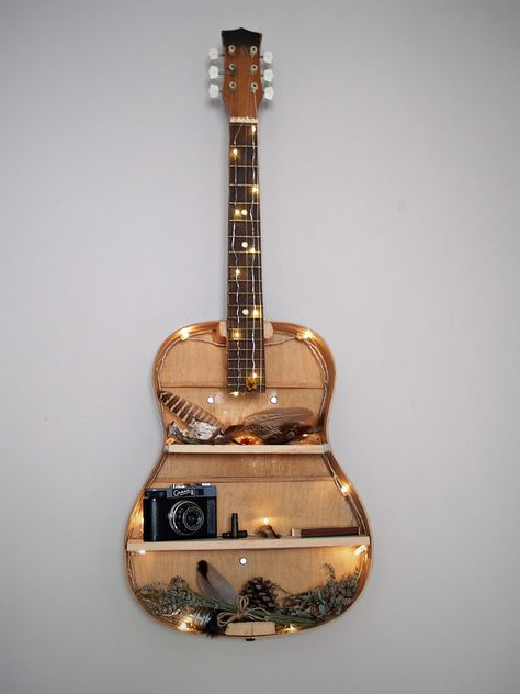 DIY guitar shelf Diy Guitar Shelf, Guitar Diy Decor, Acoustic Guitar Decoration, Guitar Decor Ideas, Guitar Art Diy, Vintage Camera Decor, Guitar Decor, Guitar Decorations, Guitar Shelf