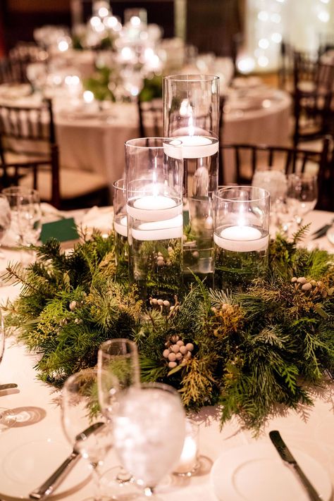 Candlelit Winter Mountain Wedding | Vail Real Wedding | Item 30 Winter Wedding Table Centerpieces Simple, Winter Green Centerpiece Wedding, Winter Green Wedding Theme, Christmas Table Decorations Wedding, Round Table Winter Wedding Decor, Winter Wedding Center Piece, December Wedding Centerpieces Receptions, Winter Wedding Tablescapes Round, Wedding Table Decorations Christmas