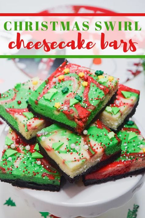 Knock their socks off with these Christmas Swirl Cheesecake Bars this holiday season. Creamy delicious vanilla cheesecake over an OREO crust! Perfect for the holiday dessert table! #dessertrecipes #dessert #christmasfood #cheesecake #cheesecakerecipes Pretty Christmas Dessert, Shortbread Bites, Holiday Dessert Table, Tradition Ideas, New Year's Desserts, Christmas Cheesecake, Swirl Cheesecake, Holiday Desserts Table, Vegan Candies