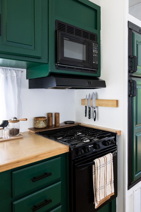 Green Kitchen Cabinets Rv, Green And White Camper Interior, Dark Green Camper Interior, Green Camper Cabinets, Green Camper Interior, Diy Camper Kitchen, Camper Aesthetic, Paint Rv, Dark Green Paint