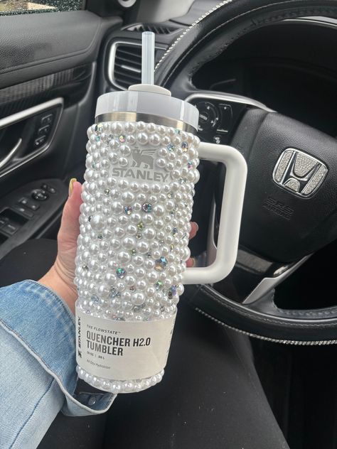 DESCRIPTION: This is for the purchase of 1, 40oz, 30oz or 20oz  Stanley quencher with hand laid rhinestones and pearls as shown. Please note that the logo on this cup is not covered in crystals. If you would like your cup to have the logo covered in crystals it is an extra charge. Please contact us with your color preference for the logo and for a quote to have the logo covered.  BASE CUP: Example photo is shown with a 30oz cup. Please note that the 20oz option does not come with a handle. We of Stanley Cup Decorations, 30oz Stanley Cup, Decorated Stanley Cup, Bling Stanley Cup, Stanley Gift Basket, Decorated Stanley, Rhinestone Stanley Cup, Bedazzled Stanley Cup, Custom Rhinestone