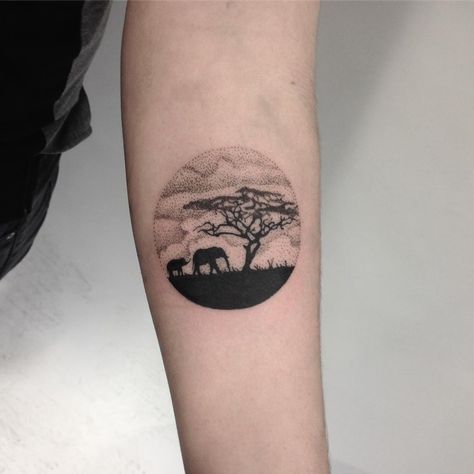 Circular African landscape tattoo on the left forearm African Minimalist Tattoo, Africa Landscape Tattoo, Africa Safari Tattoo, African Animal Tattoos For Women, Africa Small Tattoo, African Safari Tattoo Ideas, Africa Theme Tattoo, African Landscape Drawing, South Africa Tattoos For Women