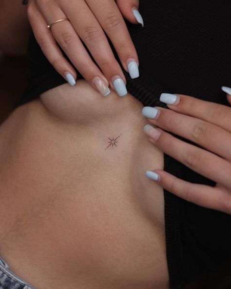 Minimalistic style north star tattoo done on the Sparkle Tattoo On Chest, North Star Back Tattoo, North Star Tattoo Behind Ear, Small North Star Tattoos, Spine Star Tattoo, Lower Chest Tattoos For Women, Sternum Small Tattoo, Dainty Stars Tattoo, Minimalistic Star Tattoo