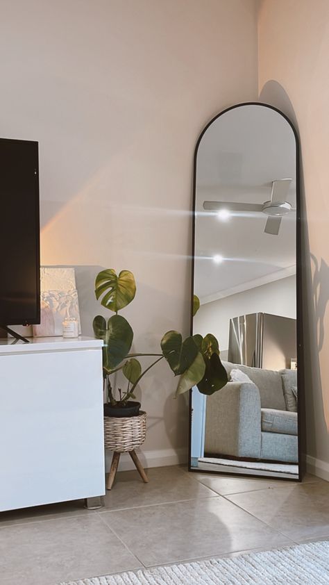 Arch Mirror In Corner, Mirror Apartment Decor, Full Length Mirror With Plants, Arch Mirror Aesthetic, Ground Mirror Bedroom, Arch Shaped Mirrors, Arch Standing Mirror, Black Arched Mirror Living Room, Big Corner Mirror Bedrooms