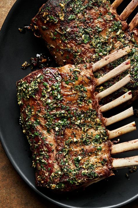 A rack of lamb is an elegant, yet easy to prepare meal. Lamb is first seared in a hot skillet and then finished in the oven with an herb oil. Serve with a bright mint sauce and veggies. Rack Of Lamb With Mint Sauce, Roast Lamb Rack Recipes, Christmas Rack Of Lamb Recipes, Roast Rack Of Lamb Recipes, Lamb French Rack Recipe, Herb Crusted Lamb Rack, Recipe Lamb Chops, Rack Lamb Chop Recipes Baked In Oven, Lamb Rack Photography