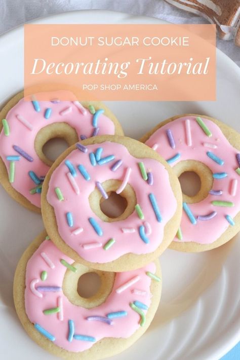 How much do you love perfectly decorated cookies? Cookie decorating is so much fun especially when you start with an easy tutorial like this. There’s no need to overcomplicate it when you can make something that’s so cute, fun and colorful! This Decorated Donut Cookie is beginner friendly and perfect for anyone regardless of your [...] The post Donut Sugar Cookie Decorating Tutorial first appeared on Pop Shop America. Donuts Cookies Decorated, Doughnut Cookies Decorated, Beginner Cookie Decorating Designs, Easy Round Cookie Decorating Ideas, Donut Decorated Cookies, Fun Sugar Cookies Decorated, Decorated Baked Goods, Cookie Designs Ideas Simple, Two Sweet Cookies Decorated