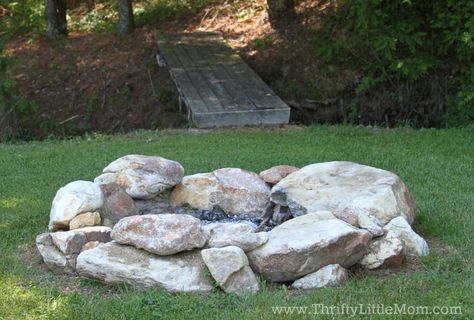 Build Your Own Backyard Fire Pit Using Free Materials » Thrifty ... Outdoor Rock Fire Pit, Diy Large Fire Pit, Rock Firepits Backyard Diy, Natural Fire Pit Ideas Backyard, Natural Stone Fire Pit Ideas, Large Stone Fire Pit, Fire Pit With Boulders, Rustic Rock Fire Pit, Rock Fireplace Outdoor