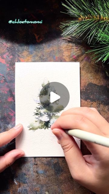 Chloe Tomomi on Instagram: "Snowy pine dream in watercolor 🌲❄️ Wet into wet approach for the snow and wet on dry for the foliage + charging in with deeper values and different temperatures. Letting them run into each other every now and then to give a more natural feel~ Got inspired by this approach by @theartsherpa on YouTube! Be sure to check her out! It feels awesome to add a new tool to one’s watercolor belt~ #chloetomomi #artreelsofinstagram #artreels #winterart #landscapeartist #watercolorpainting #watercolor" Watercolor Snowy Trees, How To Watercolor Pine Trees, How To Paint Pine Trees In Watercolor, Watercolor Christmas Trees Tutorial, Snowy Watercolor, Watercolor Art Christmas, Wet On Wet Watercolor, Trees Tutorial, Watercolor Pine Trees