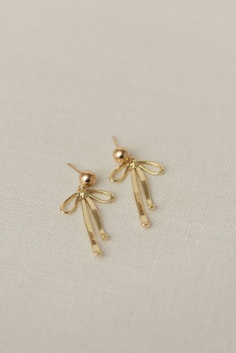 Dangly Bow Earrings | Luna & Jade – Luna & Jade Delicate Earrings Gold, It Girl Earrings, Bow Gold Earrings, Dainty Jewelry Earrings, Gold Dangly Earrings, Bow Earrings Gold, Gold Bow Earrings, Quince Earrings, Fancy Gold Earrings