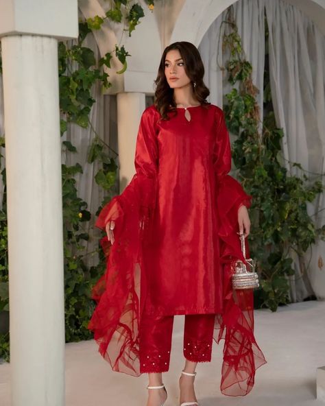 Have you ever wondered which outfit 'that girl' will wear to her next event?   Our trendy and effortlessly chic ALEENA outfit is one of those Pinterest-worthy outfits you always wanted to add to your wardrobe.  ALEENA is an outfit, with pearl details on the cuff and trousers. Not to forget the stunning statement, Organza Frill dupatta, which is the cherry on top.  Warning: Everyone around you will be complimenting this outfit. SShh... we won't tell anyone about your fav store you bought it... Ruffle Dupatta, Indian Salwar Suit, Frill Tops, Silk Bottoms, Boutique Dress Designs, Silk Dupatta, Pakistani Outfits, Anarkali, Stylish Dresses