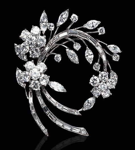 A DIAMOND AND PLATINUM BROOCH   Designed as a circular and baguette-cut diamond floral spray, accented by marquise-cut diamond leaves, mounted in platinum Bijoux Art Nouveau, Diamond Solitaire Earrings, Barbie Vintage, Diamond Brooch, Floral Spray, Royal Jewels, Vintage Jewels, Baguette Cut, Silver Gifts