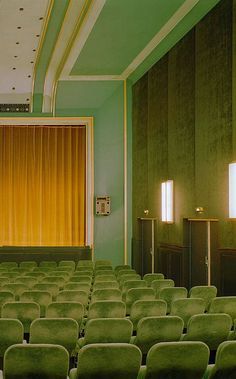 Vintage interior of a small theater decorated in shades of green and accented with gold.  #designinspo #interiorinspo #vintagemovietheaters #vintagetheaters #monochromemoment #monochromaticdesign #itsnoteasybeinggreen #greenandgold Photowall Ideas, L Wallpaper, Small Theatre, Vintage Interior, Green Rooms, Futurism, New Wall, Green Wall, Green Aesthetic