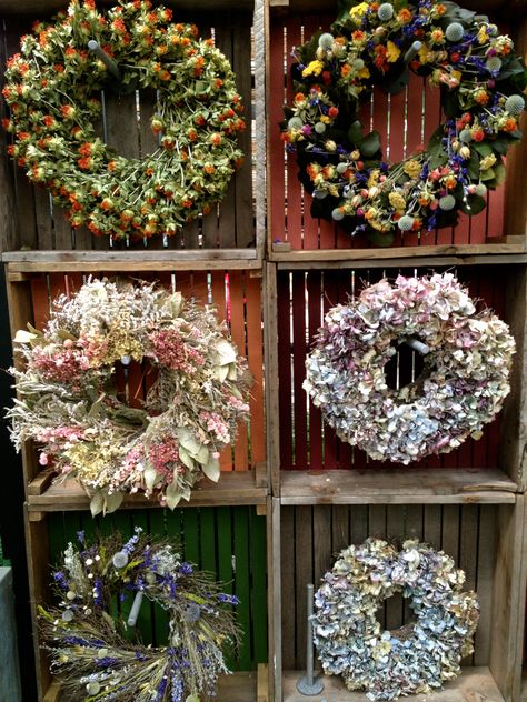 Wreath display at Terrain 8-25-13 Displays For Craft Shows, Terrain Christmas, Christmas Merchandising, Craft Show Display Ideas, Show Display Ideas, Fresh Wreaths, Wreath Display, Craft Fair Booth Display, Christmas Booth