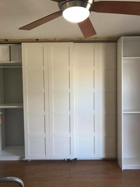 BERGSBO doors made into sliding barn doors -front view (of sliding BILLY bookcase in front of closet). the bottom 4 sliding wheels of the bookcase is hidden by the toekick of the bookcase. Ikea Sliding Door, Cheap Barn Doors, Bedroom Ikea, Billy Ikea, Sliding Door Wardrobe Designs, Billy Bookcases, Hack Ikea, Ikea Wardrobe, Ikea Closet