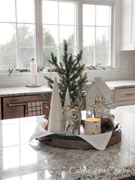 Kitchen Island Tray Decor (a Cozy Winter Theme) - Calypso in the Country Christmas Centerpieces Kitchen Table, Christmas Tree On Buffet Table, Xmas Island Decor, Christmas Center Island Decor, Christmas Wooden Tray Decor, Christmas Tray Decor Kitchen, Farmhouse Christmas Tray Decor Ideas, Christmas Center Piece For Kitchen Island, How To Style A Coffee Table Tray For Christmas