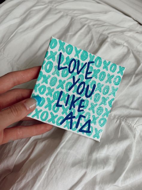 xoxo Alpha Gam Paintings, Sorority Canvas Ideas Easy, Gphi Canvas Paintings, Cute Sorority Paintings, Canvas Painting Ideas Sorority, Big Little Reveal Basket, Alpha Gamma Delta Canvas, Sorority Canvas Paintings Big Little, Axid Canvas