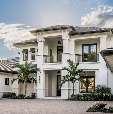 This gorgeous coastal-style residence was designed by Divco Custom Homes along with Design West, located in the luxurious Grey Oaks community of Naples, Florida. Modern Coastal Home Exterior, Minimalist House Exterior, Coastal Homes Exteriors, Florida Homes Exterior, Coastal House Exterior, West Indies Home, Coastal Home Exterior, Luxury Homes Exterior, Beautiful Exterior