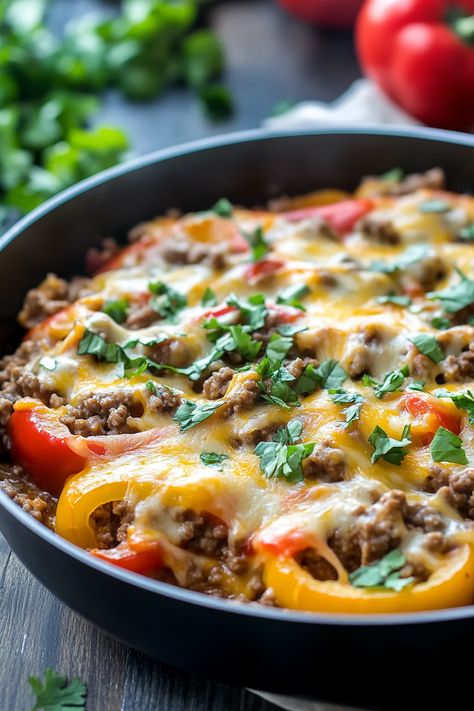 This Ground Beef Stuffed Pepper Skillet brims with all the traditional stuffed pepper flavors, but it's crafted in a single pan in under 30 minutes! Perfect for those busy weeknights, this dish is a quick and effortless dinner solution. Experience all the beloved flavors of classic stuffed peppers with this simple Stuffed Pepper Skillet recipe. Stuffed Peppers Ground Beef, Stuffed Pepper Skillet, Pepper Skillet, Stuffed Peppers Beef, Peanut Butter Fudge Easy, Stuffed Pepper Casserole, Baking With Almond Flour, Avocado Tomato Salad, Stuffed Pepper