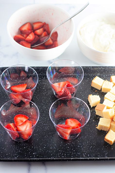 Indulge in the sweet and tangy flavors of our strawberry shortcake cups! Made with fresh strawberries and fluffy homemade whipped cream, these individual desserts with strawberries are perfect for any occasion. Try our easy recipe for mini strawberry cake cups! Strawberry shortcake trifle cups make the best mini desserts for parties! Strawberry Desserts In Cups, Easy Dessert In A Cup For Party, Strawberry Shortcake In A Cup Easy, Strawberry Shortcake Mini Desserts, Mini Strawberry Trifle, Individual Desserts In A Cup Single Serve, Diy Cake Cups, Strawberry Shortcake Cups Recipe, Strawberry Desserts Cups