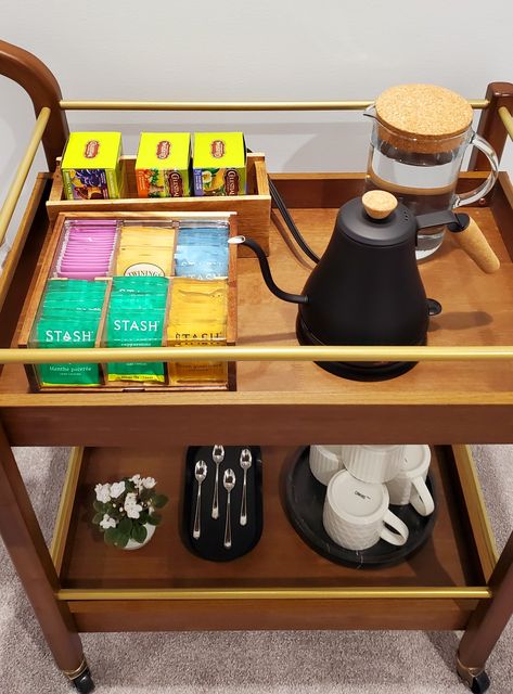 Tea bag organizer, gooseneck electric kettle, marble tray, wooden and golden bar cart. Small Coffee Tea Station, Tea Corner In Living Room, Tea Set In Bedroom, Tea Tray Display Coffee Stations, Small Tea Corner Ideas, Tea Station Office Desk, Bar Cart Tea Station, Bar Cart For Coffee, Tea Corner Ideas Bedroom