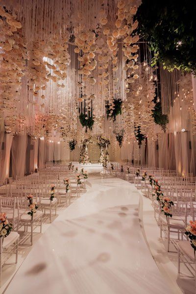 Who wouldn’t want to walk down the aisle underneath a breathtaking ceiling like this? A shower of blush florals transforms this ceremony into a romantic vision. Beautiful Weddings Venues, Over The Top Wedding Bouquet, Wedding Venues In Monaco, Grand Wedding Venue Ideas, Elegant Boho Wedding Ceremony Decor, Cute Wedding Venues Inside, Fancy Wedding Venues Indoor, Top Wedding Venues In The Us, Kpop Wedding Theme