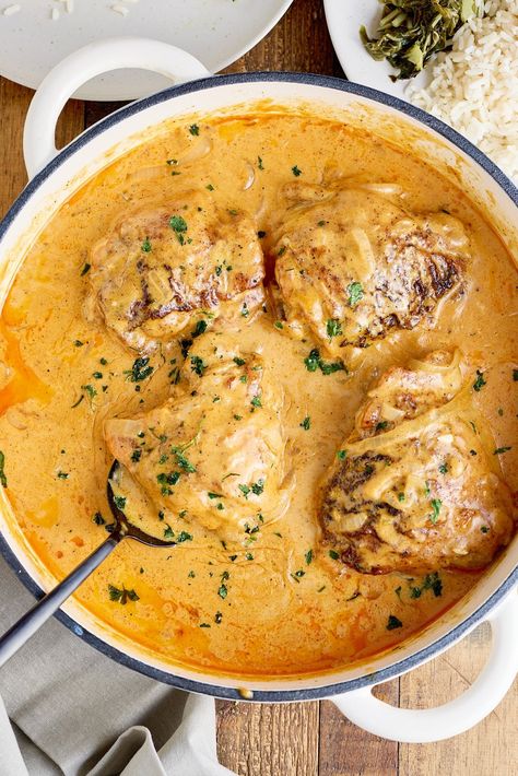 Best Smothered Chicken recipe where chicken thighs are coated in seasoned flour and sauteed, then cooked in a rich and creamy onion gravy. Chicken Dutch Oven Recipes Healthy, Smother Me Chicken, Chicken Thigh Recipes Southern, Cooking For My Soul, Dutch Oven Chicken And Gravy, Smothered Chicken Crockpot Recipes, Recipes With Chicken Thighs Bone In, Buttermilk Sauce Chicken, Chicken Thigh Sauce Recipe