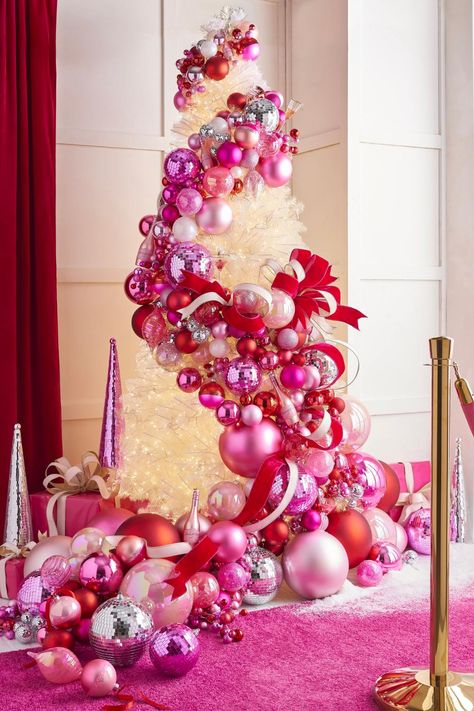 the 2024 A Blushing Holiday Christmas Tree from RAZ Christmas Tree Ball Garland, Pink Xmas Tree Decorating Ideas, Christmas Pink Decorations, Red And Pink Christmas Decor, Pink Ornaments Christmas Tree, Pink And Red Christmas Tree, Pink And Red Christmas Decor, Hot Pink Christmas Tree, Solo Christmas