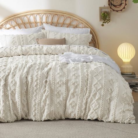 PRICES MAY VARY. Boho Bedding: This duvet cover set is inspired by a chic boho design, and its embroidered tufts in an elegant geometric pattern add a touch of sophisticated style to your sleeping space. Comfortable: This duvet cover set is brushed during production for a pleasingly soft texture, providing a delicate and soothing touch to your skin. Thoughtful Details: Eight ties inside the duvet cover ensure a secure fit to prevent your duvet insert from bunching. The zipper allows you to seal Tufted Bedding, Shabby Chic Embroidery, Elegant Duvet Covers, Comforter Sets Boho, Beige Duvet Covers, Chic Embroidery, Boho Duvet Cover, Boho Comforters, Boho Duvet