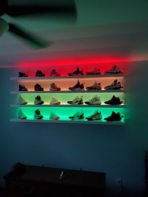 Diy floating shelves, led strips sunken in shelves with wall gromets to conceal the wires. Floating Shelves Sneakers, Led Bedroom Decor Ideas, Shoes Floating Shelves, Sneakerhead Room Wall Shelves, Shoes On Wall Shelves, Shoes On Floating Shelves, Jordan Shoe Organization, Floating Shelves Bedroom Shoes, Shoe Shelf With Led Lights