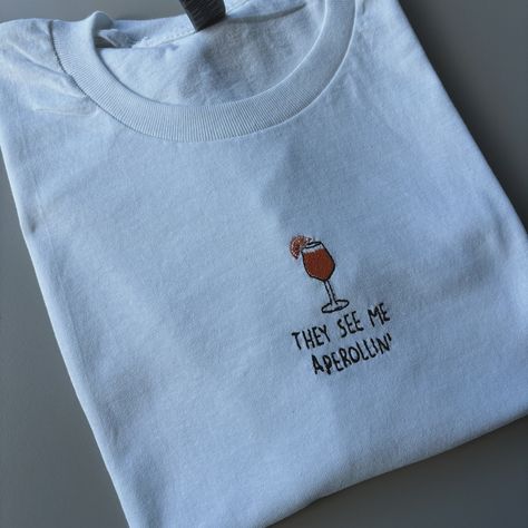 How gorgeous are these T-shirts 😭🍹 Just added them to my website! You’ll find them under core collection or search cocktail 🍸 Perfect for Summer (if we ever get one 🤣 ☀️) #embroidery #smallbusiness T Shirt Embroidery, Slogan Sweatshirt, Favourite Colour, Summer Cocktails, Embroidered Tshirt, Fashion Lighting, White Beige, Gilmore Girls, Large White