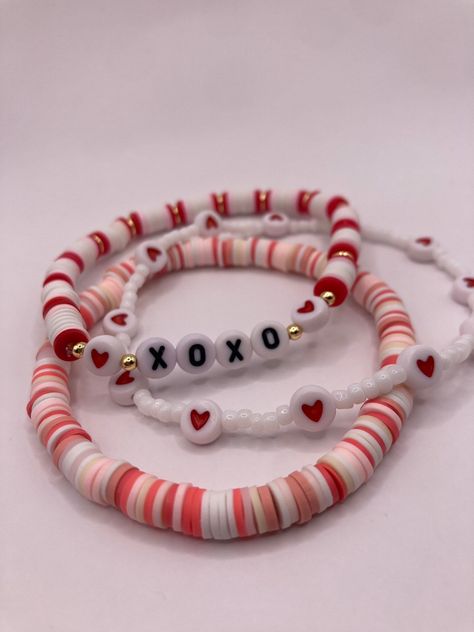 The Valentine's Day stack comes with 7 bracelets-- four seed bead bracelets and 3 clay heishi bead bracelets.  Handmade with love and care and shipped from central Texas ️ Clay Bead Bestie Bracelet Ideas, Cute Bracelet Ideas Words, Bracelets With Flat Beads, Clay Beads Friendship Bracelet Ideas, Red And Pink Clay Bead Bracelets, Birthday Bracelet Ideas Clay Beads, How To Make Clay Beads Bracelet, Seed Bead And Clay Bead Bracelets, Clay Bead Bracelet Ideas Lilo And Stitch