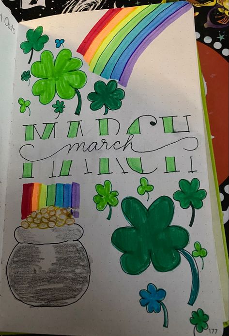 Center page has March written in two split styles in green with clovers and a four leaf clover in shades of green above the left and below the right of March. Bottom left has a pot of gold with a rainbow shining from the pot of gold arching over the top right of March. March Drawings Ideas, March Notebook Ideas, Planer March, March Scrapbook Ideas, March Dot Journal, March Calendar Doodles, March Chalkboard Ideas Calendar, March Dot Journal Ideas, March Journal Page