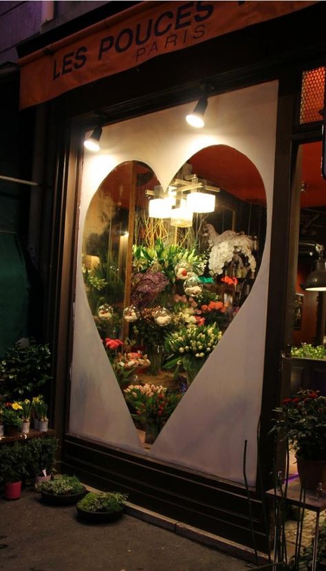 Window shopping in Paris So romantic! Warm and charming... The heart draws a customer in to see what is on the inside. Valentines Window Display, Flower Shop Display, Display Visual Merchandising, Shopping In Paris, Window Drawing, Window Graphics, Retail Windows, Flowers Shop, Florist Shop