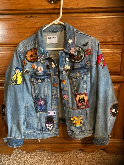 This is my jean jacket i’ve been working on for about 3-4 years now! Everythings hand sewn on, and some of the patches and pins i’ve made myself. Pin Jean Jacket, Jean Jacket Pins And Patches, Denim Jacket With Patches And Pins, Denim Jacket Pins And Patches, Diy Denim Jacket Patch, Diy Patch Jacket, Jean Jacket Patches Ideas, Jean Jacket With Pins, Denim Jacket Design Ideas