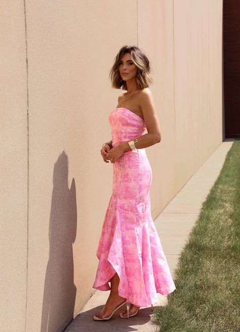 Get ready to turn heads in our Fancy Evening Dress! This maxi dress is perfect for your next date night or formal event. The strapless design and mermaid silhouette are both photogenic and flattering. Look and feel your best in this stunning dress. Fabric 100% polyester Lining 95% polyester, 5% spandex Long Homecoming Dresses 2024, Pink Ruffle Bridesmaid Dress, Erica Ha Prom Dress, Prom Dresses Easter, Love Shack Fancy Prom Dress, Sunset Colored Dress, Wedding Outfit Inspo Guest, Formal Pink Midi Dress, Prom Dresses 2025 Ideas