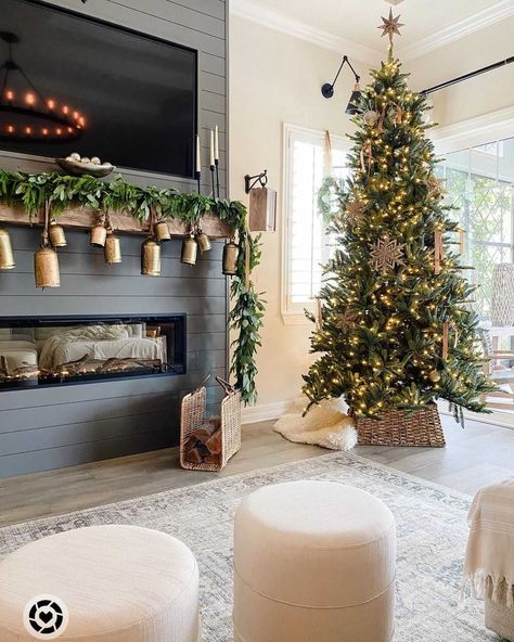 We LOVE this Christmas tree, dark shiplap, and gold bells!🤩 +TAP the link in bio for a similar look!! 📸@thedailynest #mantel #manteldecor #mantle #mantledecor #fireplace #fireplacedecor #christmasdecor #christmasdecorations #christmastree #winterdecor #livingroom #livingroomdecor #livingroomdesign #neutralhome #shiplap #modernfarmhouse #farmhouselove #farmhousedecor #farmhousestyle #farmhouseliving #cozyspaces #modernfarmhousestyle #entrwaydecor #entrydecor #farmhousechic #cottagestyle Cozy Christmas Decor, Neutral Christmas Decor, Christmas Mantel, Christmas Decor Inspiration, Christmas Mantel Decorations, Christmas Mantle, Christmas Living Rooms, Christmas Inspo, Christmas Decorations For The Home