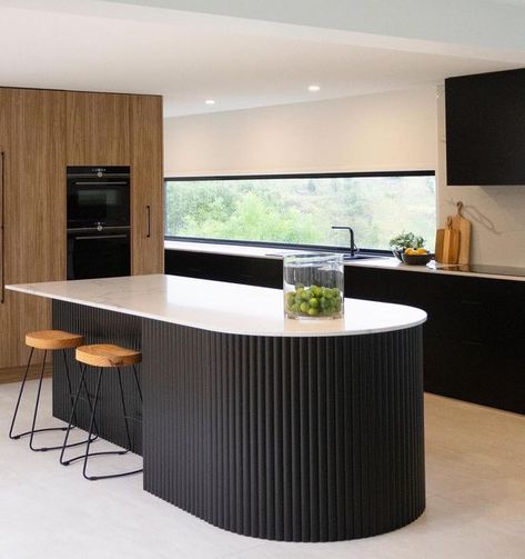 Imperial. Kitchens by Design on Instagram: "A curved island bench has been all the craze lately! We are thrilled to see this kitchen come to life 🖤 Doors: @bonlexaustralia ~ Black Satin Flat Profile Feature Island: @porta_timber ~ Black Curved Contour Benchtop: @stoneambassadoraus ~ Statuario Signature #imperialkitchens #kitchenrenovation #kitchens #kitchendesign #interiordesign #homedecor #interiors #kitchensofinstagram #home #kitchenideas #kitcheninspiration #kitchenisland #kitchengoals #re Kitchen Island Oval, Fluted Curved Kitchen Island, Timber Look Kitchen, Black Island Bench, Curved Kitchen Bar Counter, Fluted Island Bench, Feature Kitchen Island, Curved Kitchen Benchtop, Feature Island Kitchen