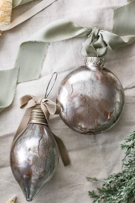 Get ready to impress with these DIY faux mercury glass Christmas ornaments. Your tree will sparkle like never before! Faux Mercury Glass Ornaments Diy, Clear Plastic Ornaments Diy, Diy Clear Ornament Ideas, Glass Ornaments Diy, Krylon Looking Glass, Dollar Tree Mirrors, Clear Plastic Ornaments, Mercury Glass Diy, Silver Spray Paint