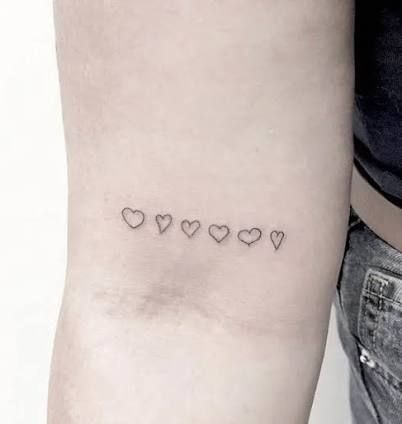 Siblings Heart Tattoo, Small Tattoo Placement Wrist, Hearts On Forearm Tattoo, Family Member Heart Tattoos, Hearts From Family Tattoo, Kids Draw Heart Tattoo, Family Heart Drawing Tattoo, Minimalist Heart Tattoo Simple, Row Of Hearts Tattoo