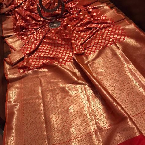 RARE RUST ORANGE COLOURED BEAUTY Super soft luxurious banarasi opada silk drapes of elegance with rich zari weaves with grand zari weaving pallu with soft silk zari weaving border bp. #saree #sarees #banarasisaree #opada #artisianofindia #weaving #sareelove #localforvocal #vastravalley #vastravalleysilk #silksarees #desi #auspicious #desifashion #desiwear #desiclothes #indiancouture #indianwedding #indianwear #indianbride #weddingguestoutfit #styleinspiration #bridaltrousseau #weddingseason #fa Rust Orange Silk Saree, Orange Banarasi Saree, Orange Silk Saree, Silk Drapes, Kanjivaram Saree, Desi Wear, Desi Clothes, Wedding Saree Indian, Indian Couture