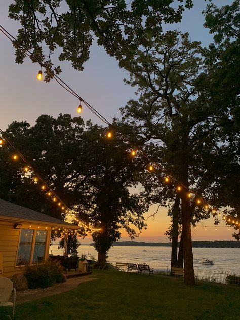 Beautiful lake sunset with string lights Porch View Aesthetic, House On The Lake Aesthetic, Old Lakehouse Aesthetic, Lake Resort Aesthetic, Lake Aethestic, California Lake House, Lakeside House Aesthetic, House On A Lake Aesthetic, Lake House Life Aesthetic