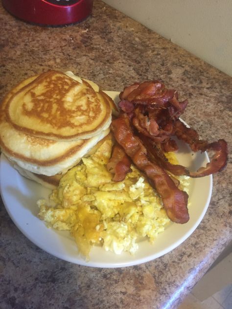 Homemade Breakfast pancakes, eggs and bacon Eggs Bacon Pancakes, Soul Food Breakfast Plates, Pancakes And Bacon Breakfast, Bacon And Eggs Breakfast Plate, Pancake Eggs Bacon Breakfast, Pancakes Eggs And Bacon Breakfast, Pancakes On Blackstone Griddle, Eggs And Bacon Aesthetic, Food Pictures Breakfast