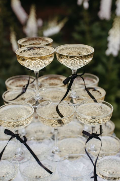 Elevate your garden party with this stunning champagne tower! The perfect centrepiece to add elegance and style to your outdoor celebration. ⁠Cheers to unforgettable moments! Christmas Venue, Cocktail Hour Decor, Elegant Engagement Party, Outdoor Celebration, Elegant Birthday Party, Champagne Tower, Champagne Party, Wedding Buffet, Portugal Wedding