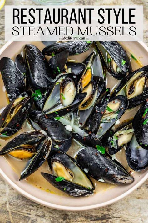 Tender steamed mussels in a white wine broth is an easy and irresistible recipe! Get all the tips for how to buy, clean, and cook mussels. Mussels Recipe White Wine, Cooking Mussels, Steamed Mussels, Mussels Recipe, The Mediterranean Dish, White Wine Sauce, Muscle Food, Broth Recipes, Wine Sauce