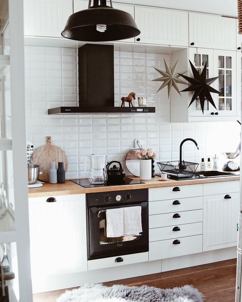 White And Black Kitchen With Wood, White Kitchen And Black Appliances, Neutral Kitchen With Black Appliances, All White Kitchen Black Appliances, Black Sink Wood Countertop, White Kitchen Black Accessories, Kitchen White Black And Wood, Black And White Kitchen With Wood, Black Sink White Kitchen