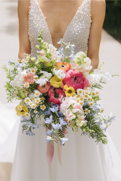 Romee Willow Florals created this colorful bridal bouquet for Alex & Aeryn's spring wedding at Greenhouse Loft. The bride wanted her bouquet to look colorful, loose, natural and whimsical, like a bouquet of wildflowers. They gathered inspiration from one of their favorite Wes Anderson movies, Moonrise Kingdom. Learn more details and see photos from their spring wedding on the blog. Wedding planner: Naturally Yours Events Photography: Ed and Aileen Photography Wildflower Wedding Theme Bouquet, Pastel Rainbow Bouquet, Spring Floral Wedding Bouquet, Rainbow Bridal Bouquet, Meadow Wedding Bouquet, English Garden Wedding Bouquet, Colorful Spring Wedding Bouquets, Bride Bouquets Spring, Colorful Flower Bouquet Wedding